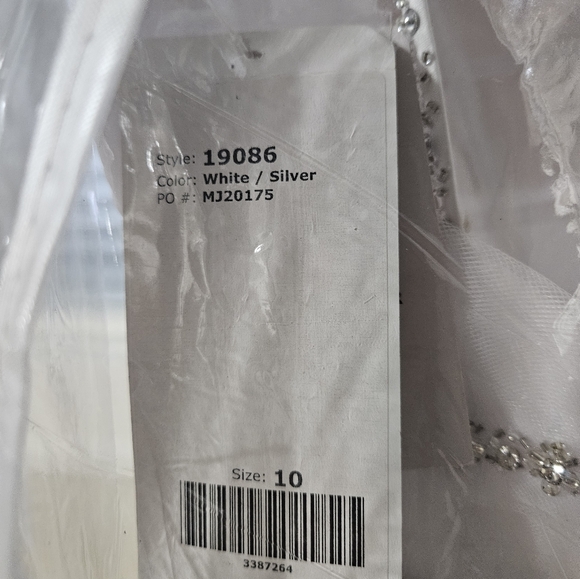 Size 10 white tulle full Aline bridal gown with silver trim. NWT - Picture 3 of 16